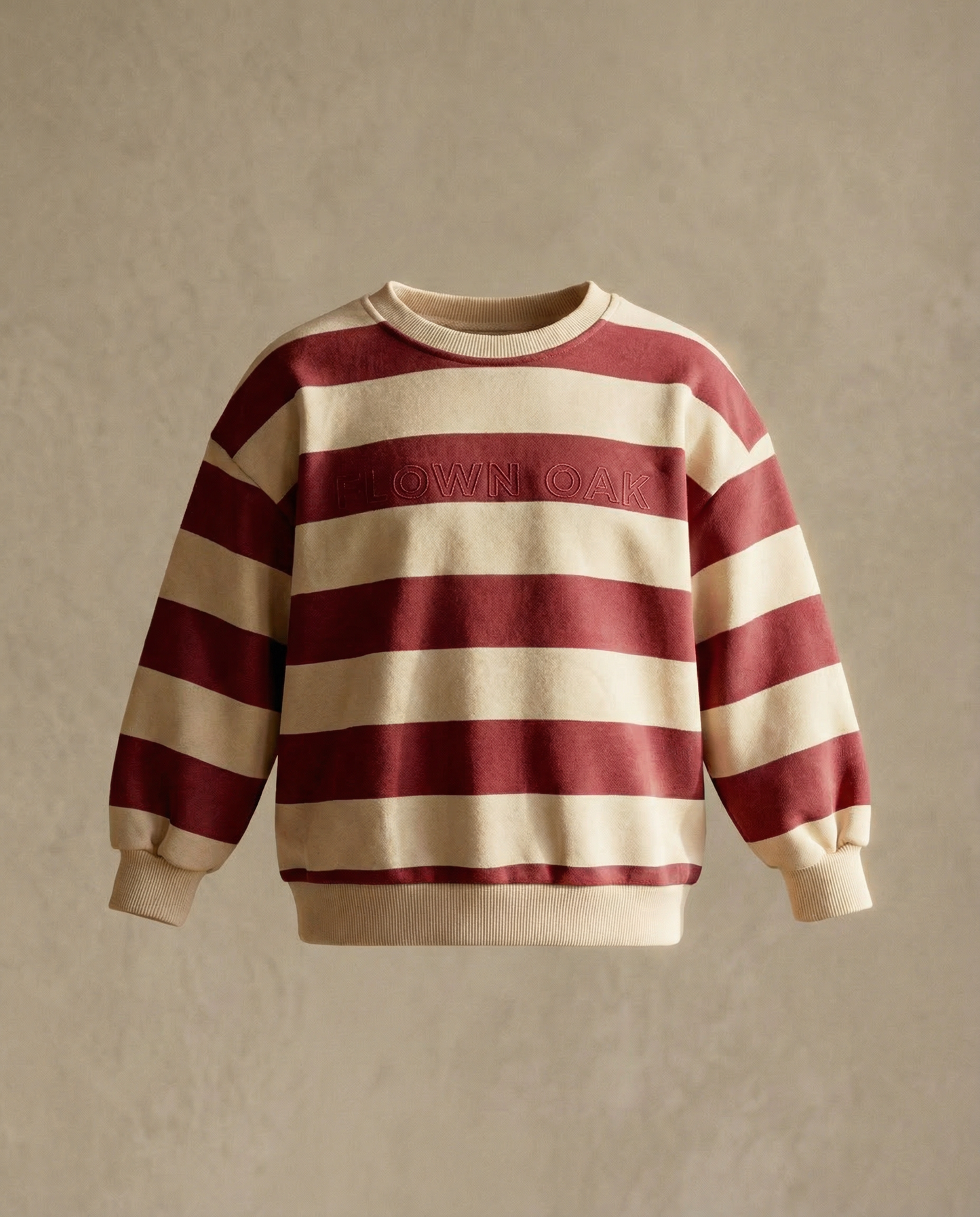 Red and beige striped sweater on a beige background