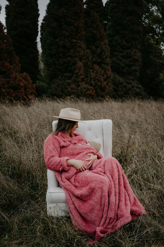 Mother breastfeeding her baby in a plum BHOOMI Breastfeeding Blanket