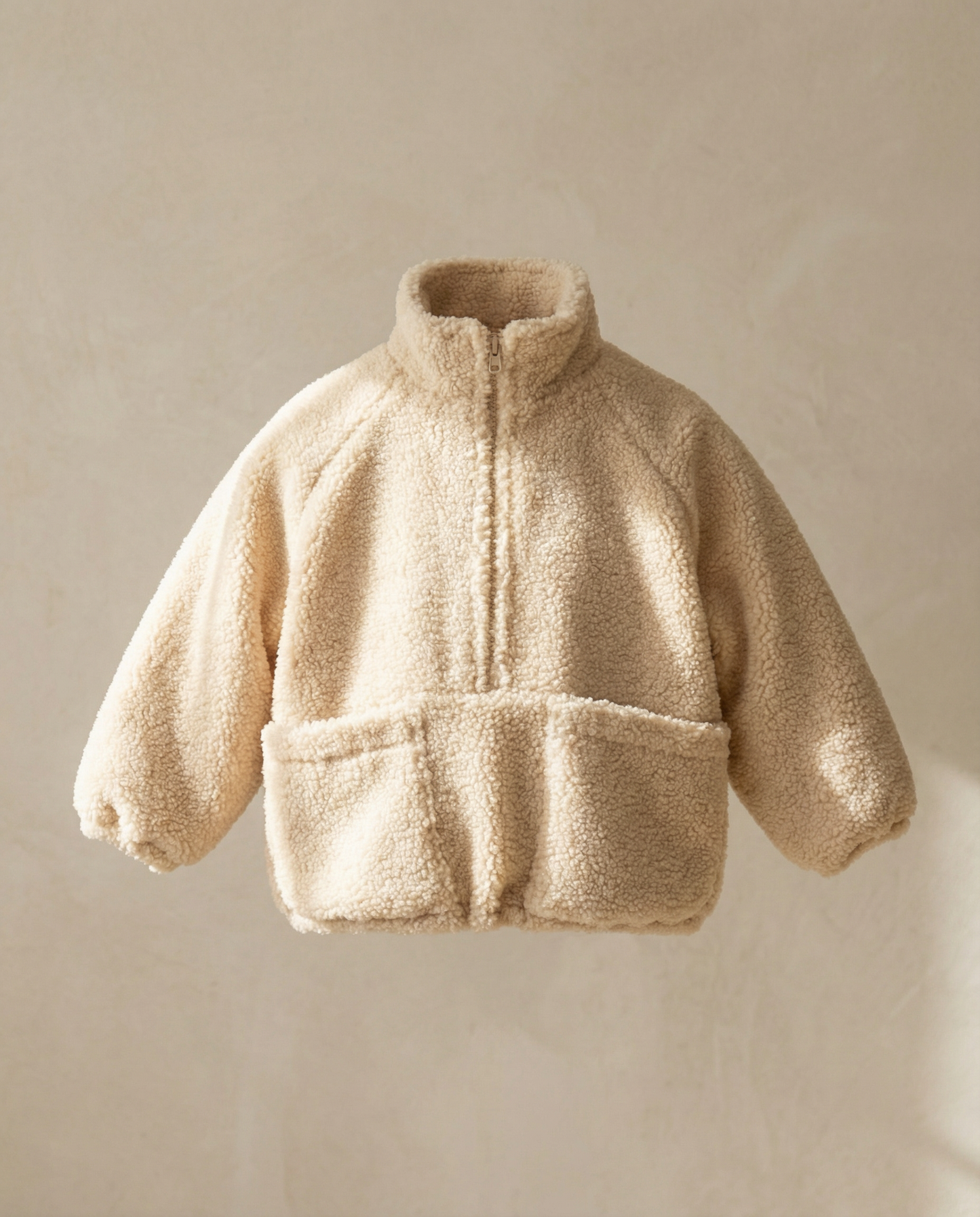 Beige fleece jacket on a beige background