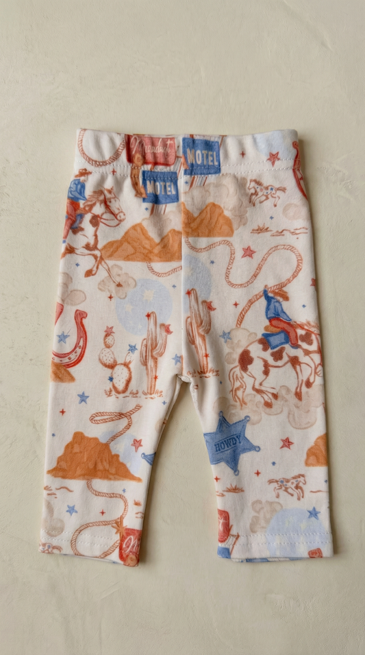 Children's leggings with cowboy print on a beige background
