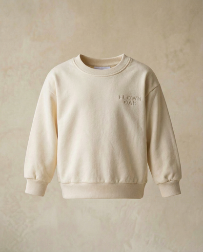 Beige sweatshirt with 'Flown Oak' embroidery on a beige background