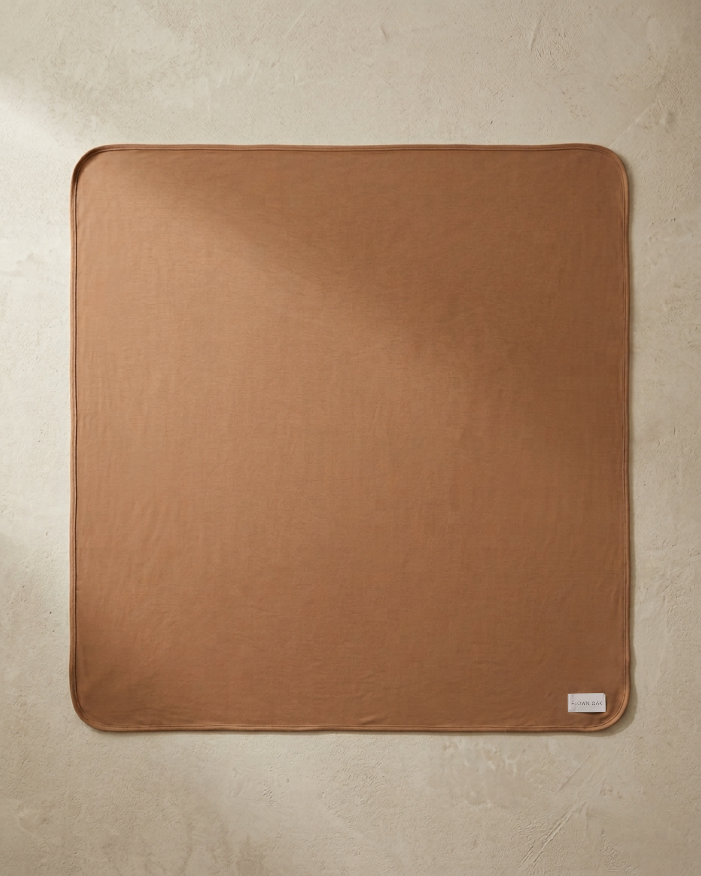 Brown swaddle on beige background