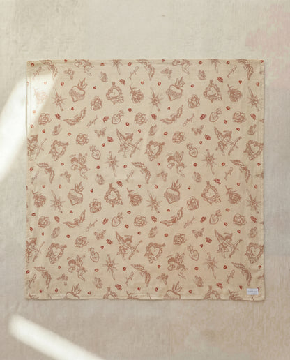 Fabric with nature-themed pattern on a beige background