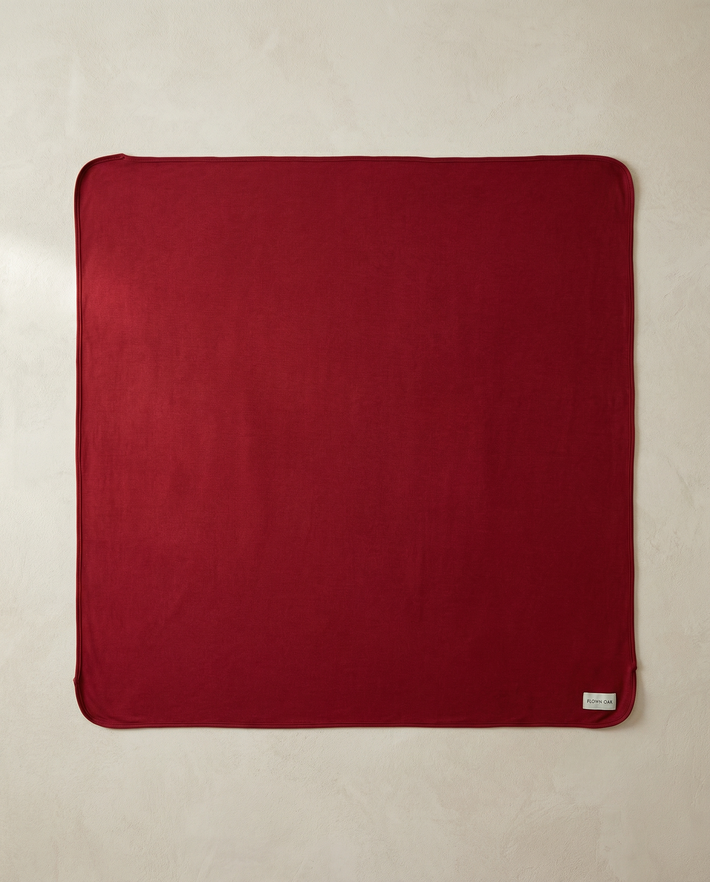 Red swaddle on a beige background