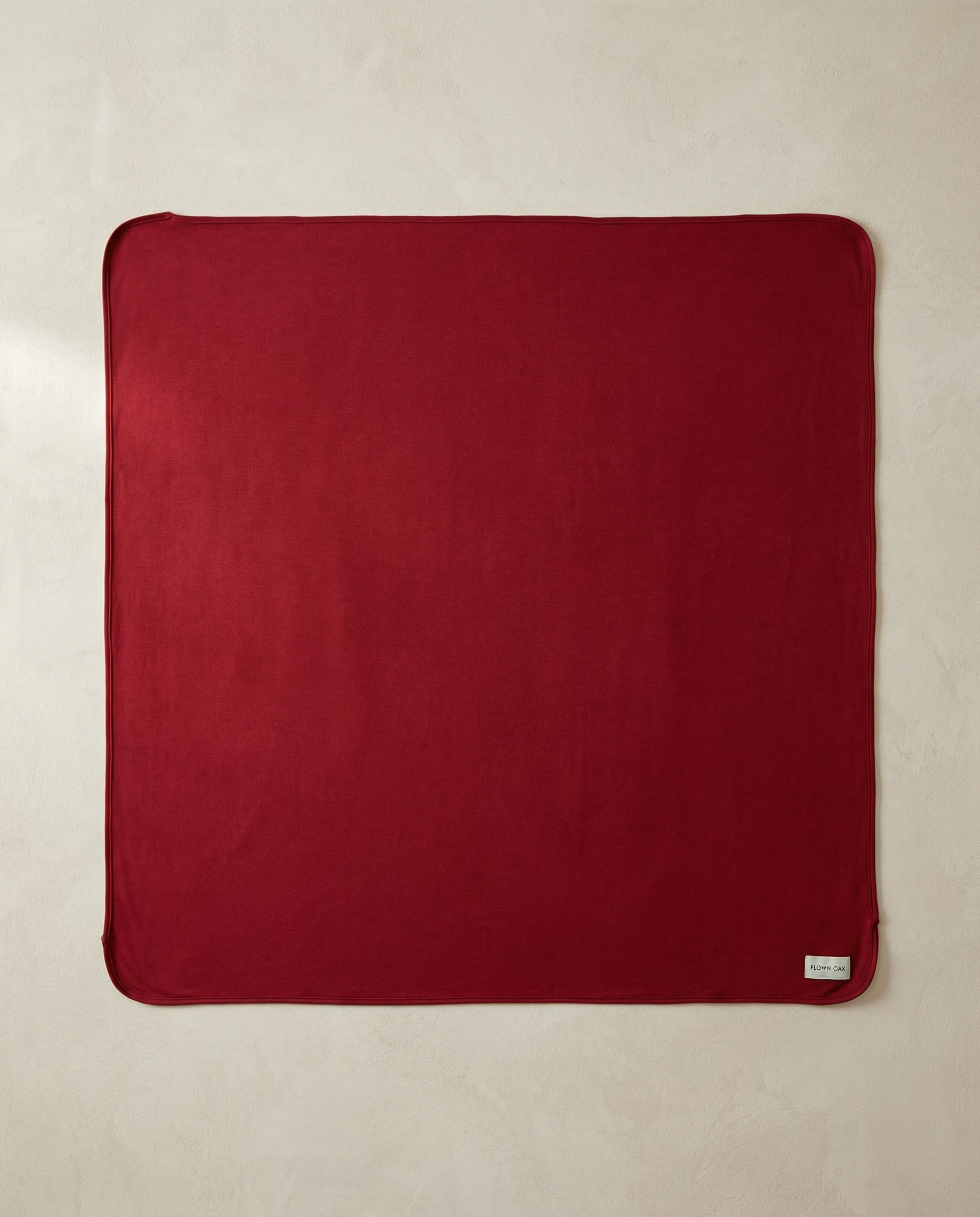 Red swaddle on a beige background