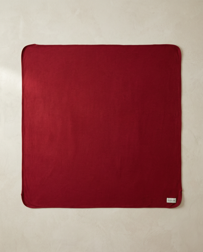 Red swaddle on a beige background